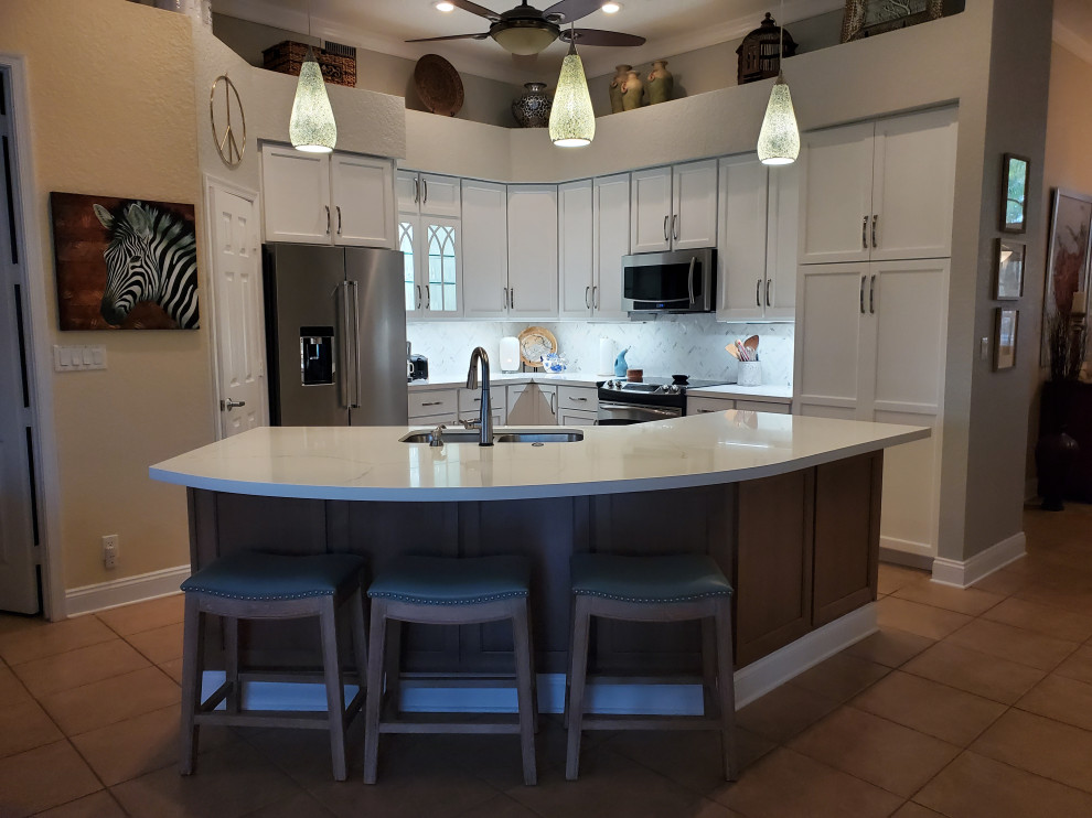 Medium sized contemporary l-shaped kitchen/diner in Miami with a submerged sink, engineered stone countertops and an island.