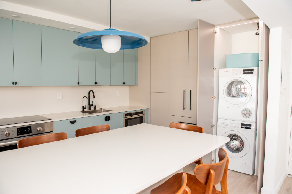 Photo of a medium sized contemporary l-shaped kitchen/diner in Miami with engineered stone countertops.