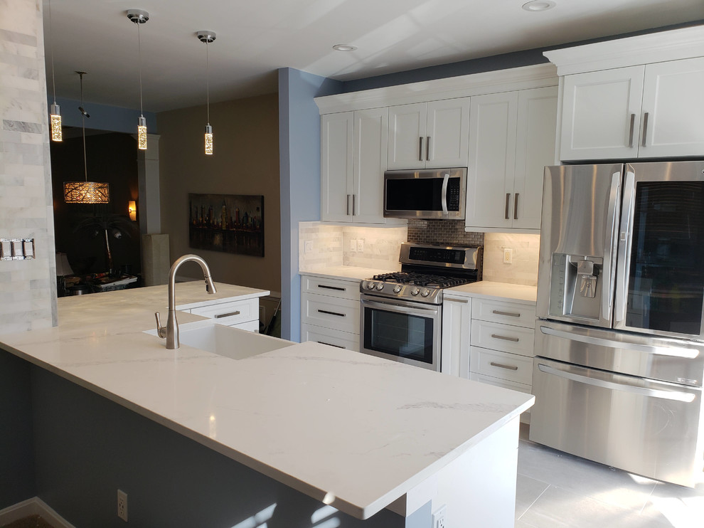 Contemporary Kitchen remodel with high end marble, steel, and quartz