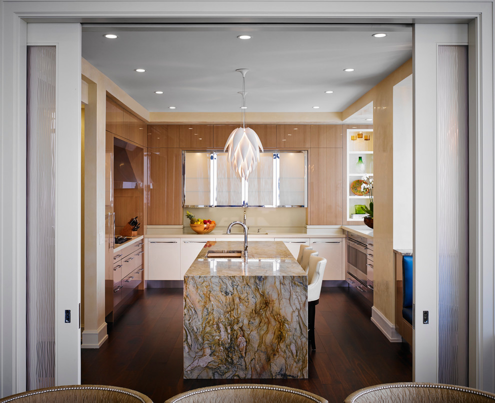 Example of a mid-sized trendy u-shaped dark wood floor enclosed kitchen design in Chicago with an undermount sink, flat-panel cabinets, medium tone wood cabinets, an island, solid surface countertops, beige backsplash, stone slab backsplash and stainless steel appliances