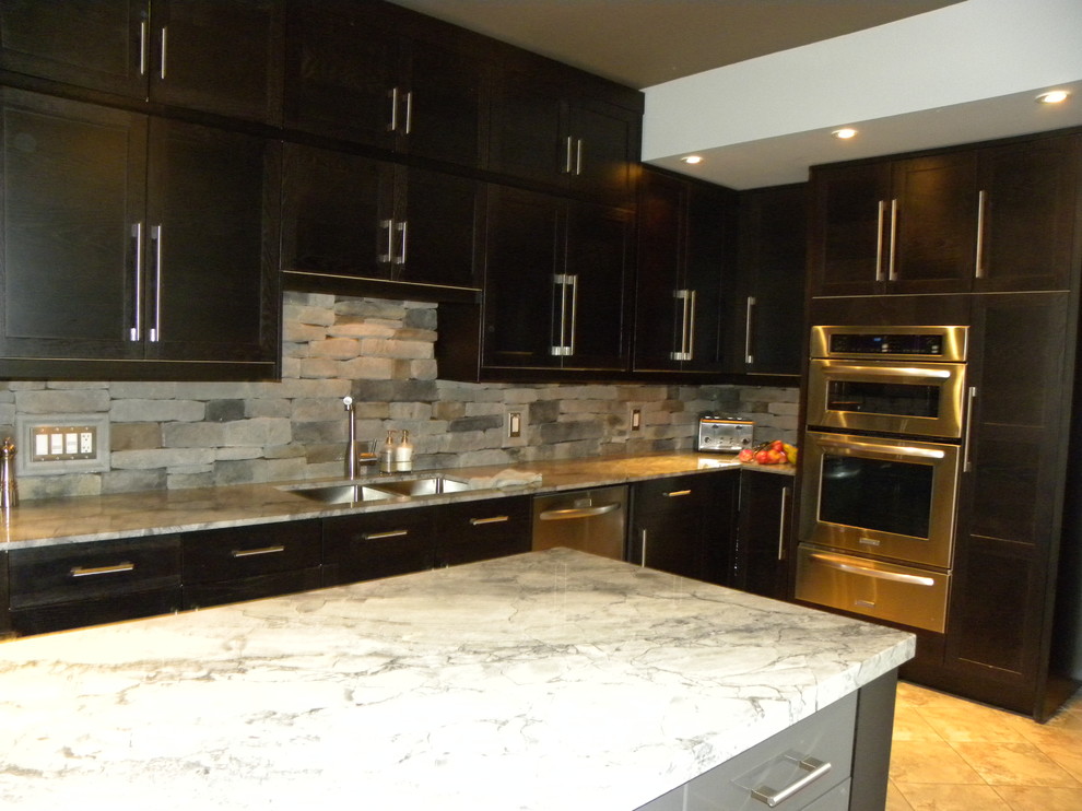 Example of a small trendy galley ceramic tile kitchen pantry design in Toronto with a double-bowl sink, flat-panel cabinets, dark wood cabinets, granite countertops, multicolored backsplash, stone tile backsplash, stainless steel appliances and an island