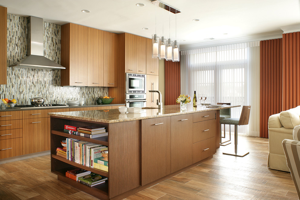 This is an example of a medium sized contemporary galley kitchen/diner in Other with a submerged sink, flat-panel cabinets, medium wood cabinets, engineered stone countertops, multi-coloured splashback, glass tiled splashback, stainless steel appliances, porcelain flooring, an island and brown floors.