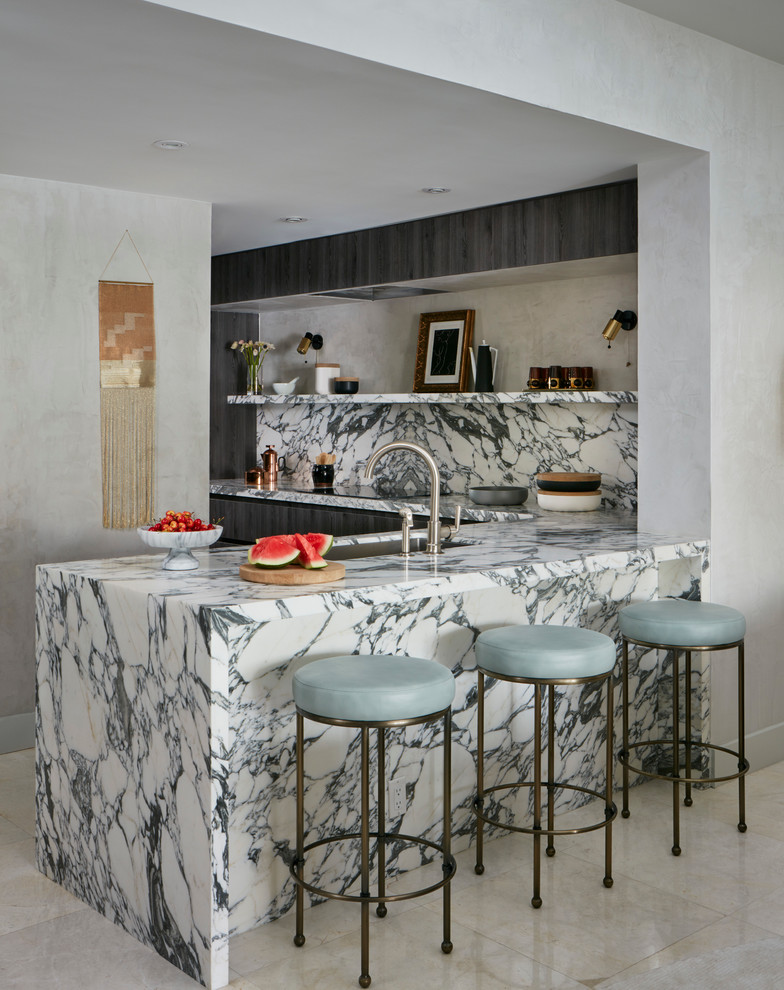 Example of a small trendy l-shaped kitchen design in Miami with flat-panel cabinets, dark wood cabinets, marble countertops, multicolored backsplash, stone slab backsplash, stainless steel appliances and an island