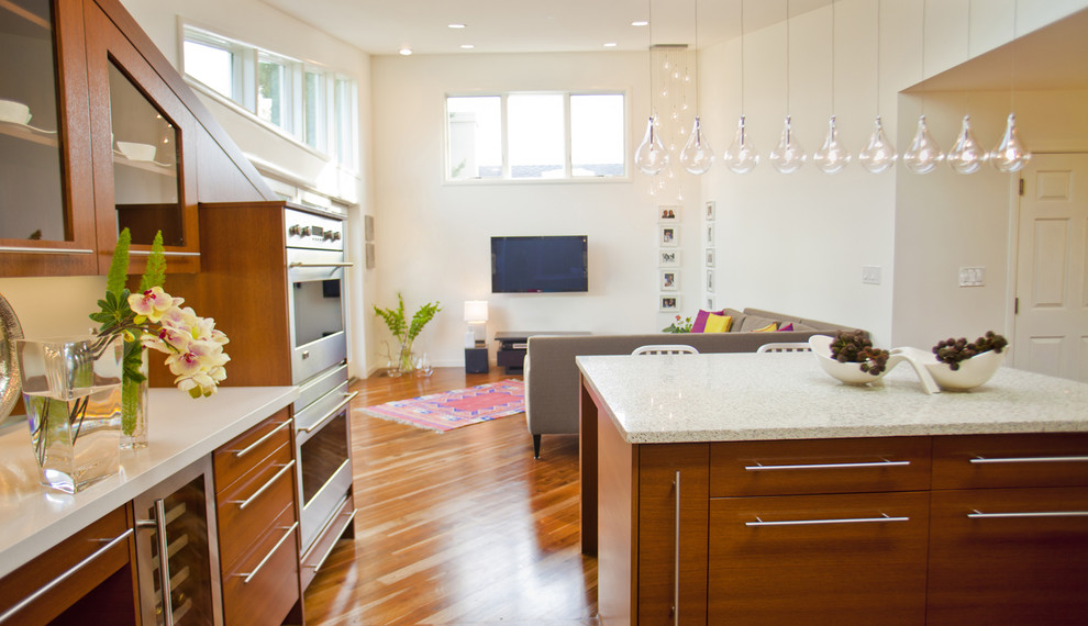 This is an example of a contemporary kitchen in San Francisco with glass-front cabinets.