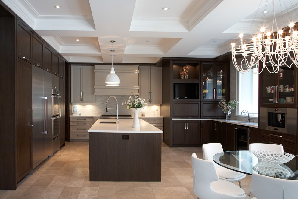Inspiration for a contemporary u-shaped travertine floor and beige floor eat-in kitchen remodel in Toronto with recessed-panel cabinets, dark wood cabinets, stainless steel appliances, an undermount sink, quartz countertops, white backsplash, marble backsplash and white countertops