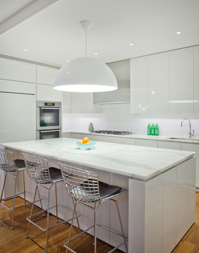 Photo of a contemporary kitchen in New York with marble worktops.