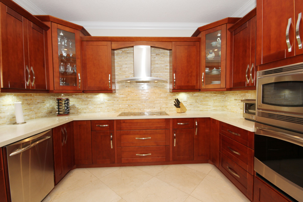Inspiration for a contemporary u-shaped enclosed kitchen remodel in Miami with an undermount sink, shaker cabinets, medium tone wood cabinets, quartzite countertops, beige backsplash and stainless steel appliances