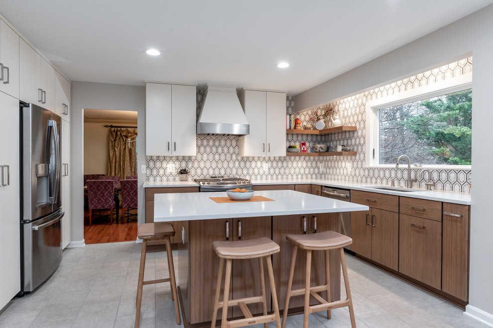 Eat-in kitchen - mid-sized contemporary l-shaped ceramic tile and gray floor eat-in kitchen idea in Baltimore with an undermount sink, flat-panel cabinets, white cabinets, quartz countertops, white backsplash, ceramic backsplash, stainless steel appliances, an island and white countertops