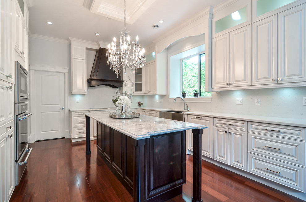 Contemporary kitchen with raised-panel cabinets Vancouver ...