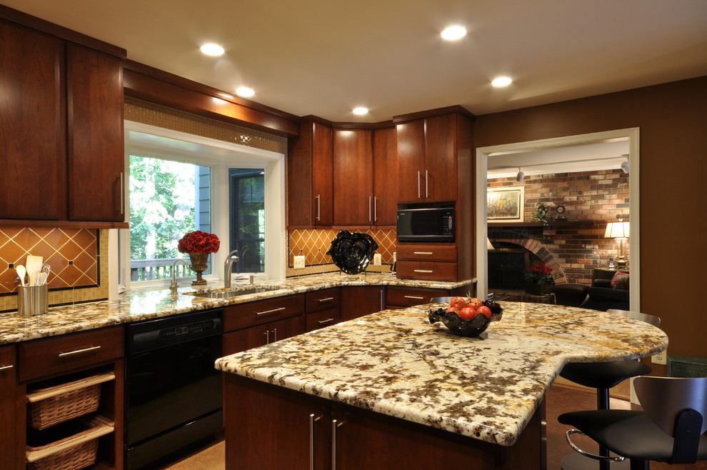 Example of a mid-sized trendy kitchen design in DC Metro with flat-panel cabinets, medium tone wood cabinets, orange backsplash, stainless steel appliances and an island