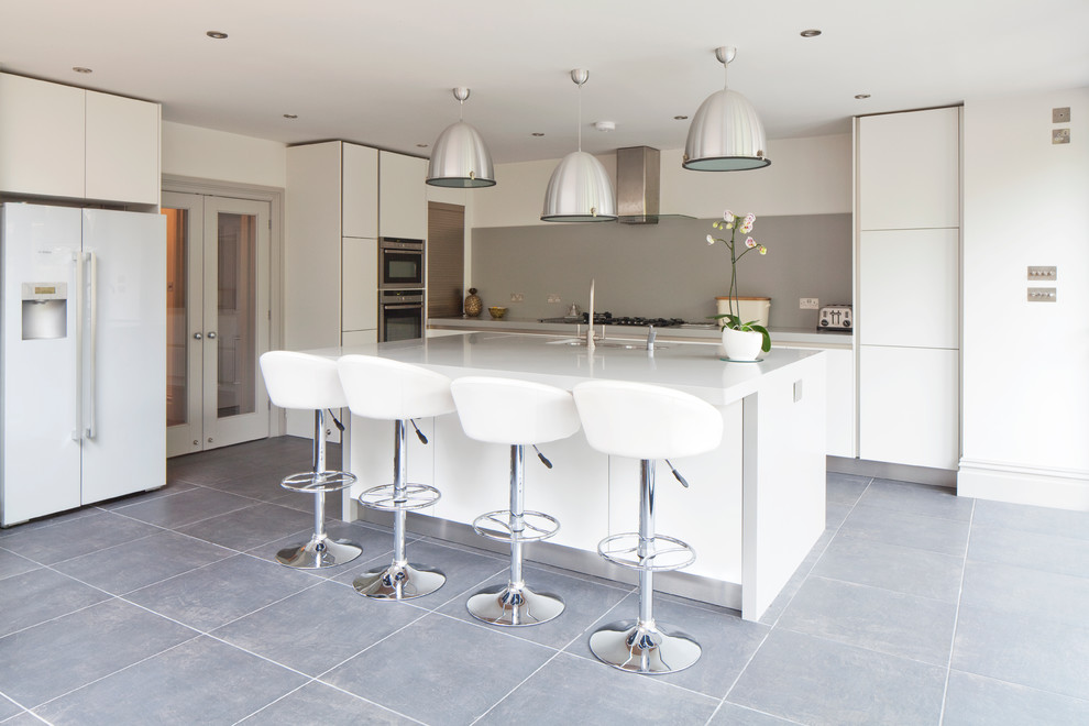 Photo of a contemporary l-shaped kitchen/diner in Sussex with an island.