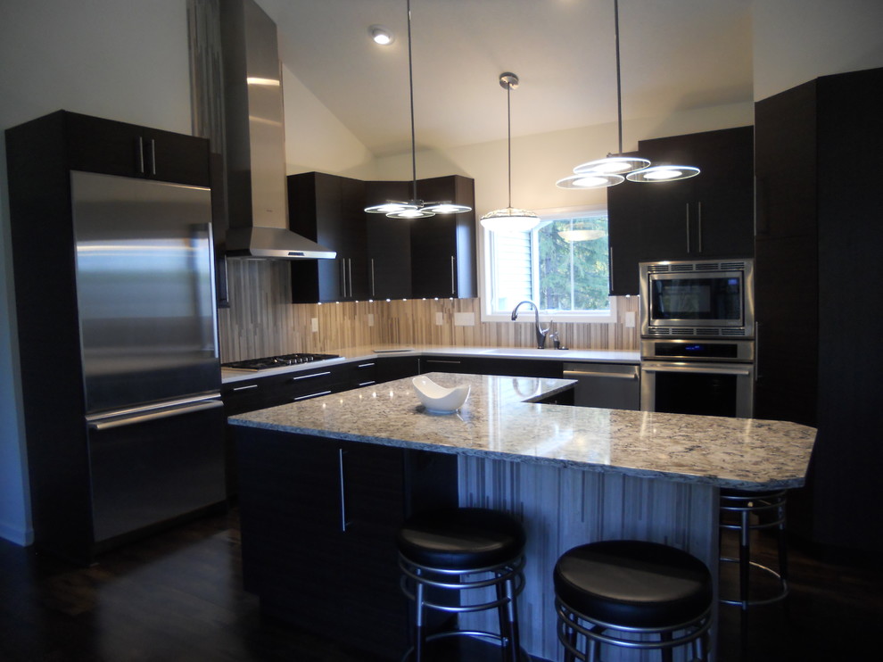 Inspiration for a contemporary l-shaped enclosed kitchen remodel in New York with an undermount sink, flat-panel cabinets, dark wood cabinets, quartz countertops, beige backsplash, stone tile backsplash and stainless steel appliances