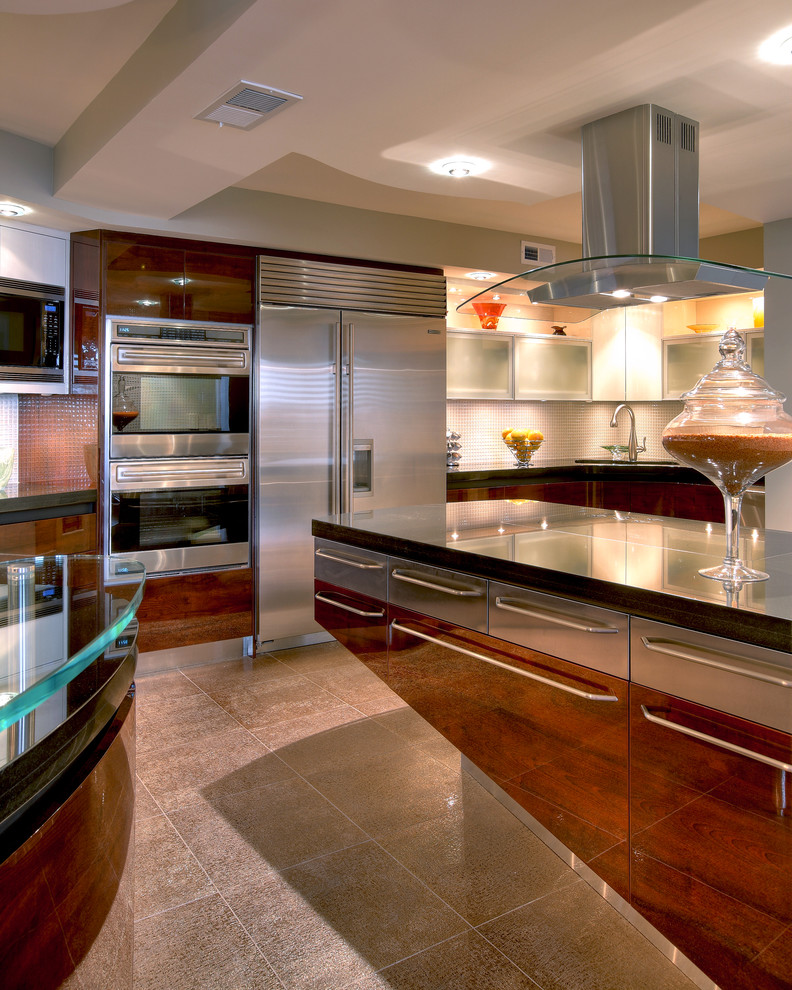 Example of a large trendy kitchen design in Miami with flat-panel cabinets, dark wood cabinets, glass countertops and stainless steel appliances