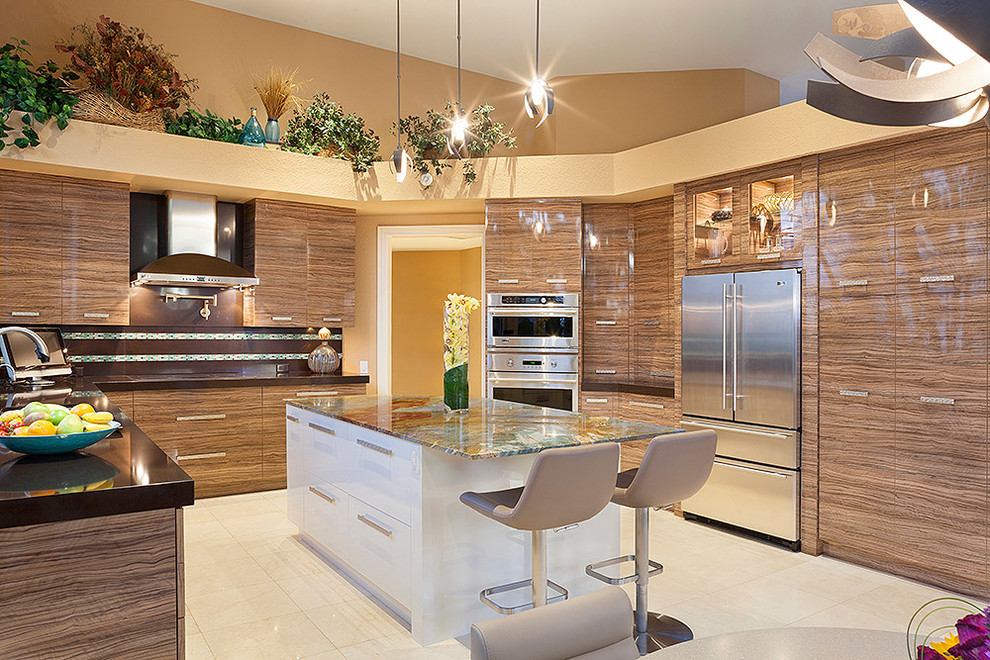 Inspiration for a large contemporary u-shaped ceramic tile and beige floor eat-in kitchen remodel in Miami with an island, brown cabinets, flat-panel cabinets, solid surface countertops, multicolored backsplash, stainless steel appliances and black countertops