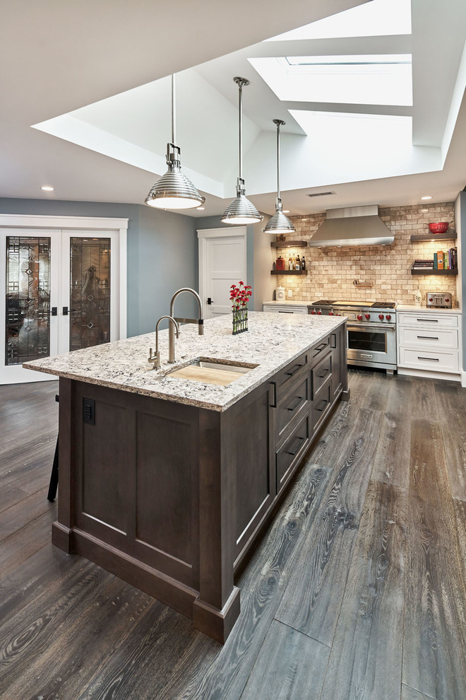 Example of a large transitional l-shaped dark wood floor open concept kitchen design in San Francisco with an undermount sink, beaded inset cabinets, gray cabinets, quartz countertops, gray backsplash, stone tile backsplash, stainless steel appliances and an island