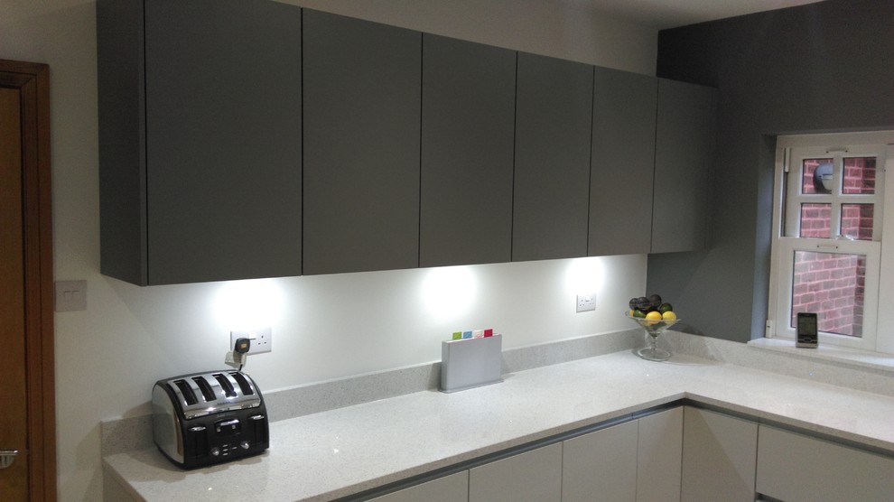 Contemporary, matt grey kitchen & contrasting dark grey wall units