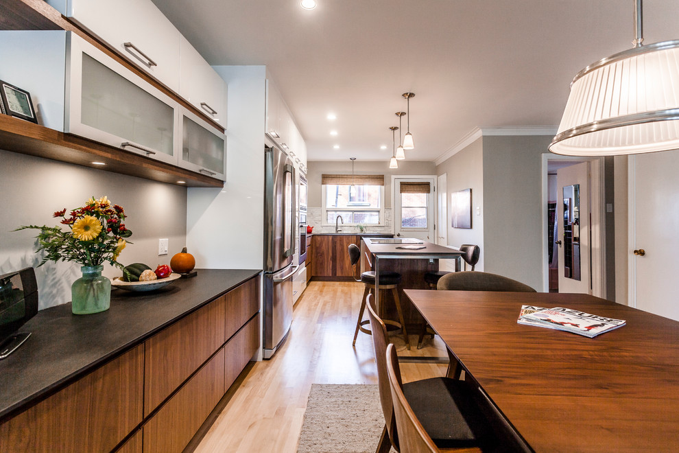 Kitchen - mid-sized contemporary kitchen idea in Montreal with flat-panel cabinets
