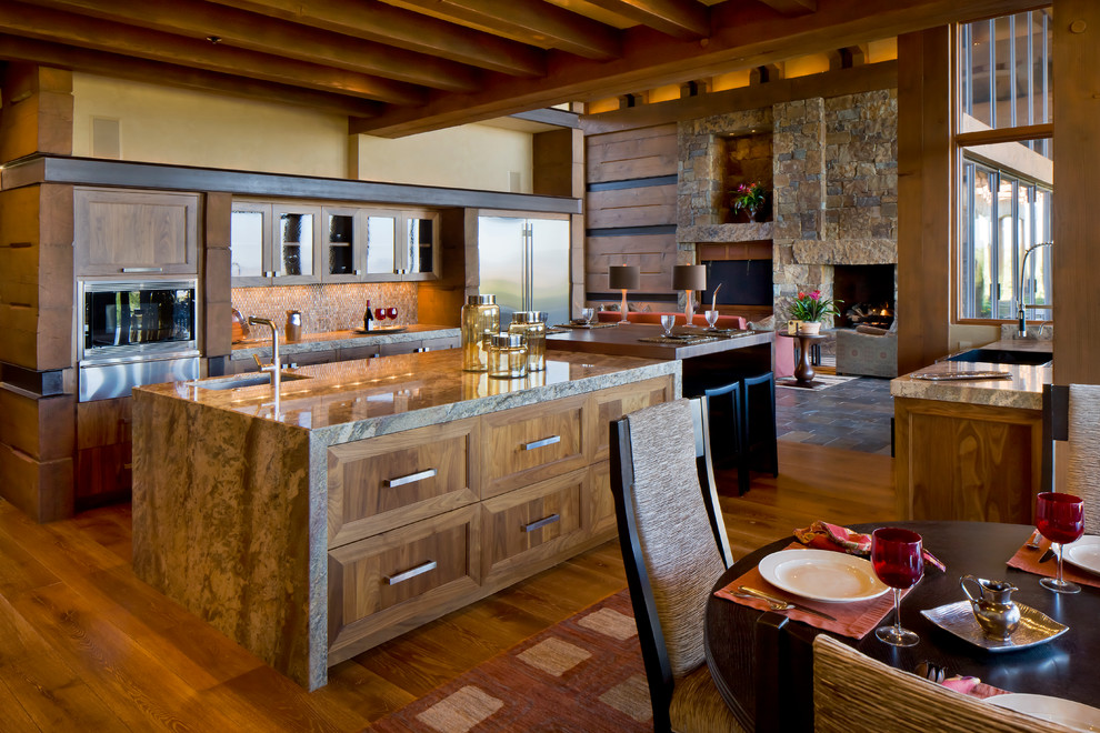 Exempel på ett modernt kök med öppen planlösning, med skåp i shakerstil, skåp i mellenmörkt trä, granitbänkskiva, rostfria vitvaror, mellanmörkt trägolv och en köksö