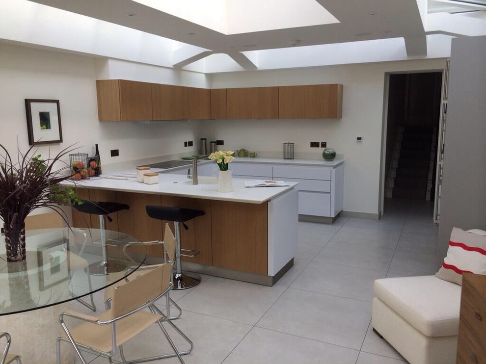 Photo of a modern kitchen in Cheshire with an integrated sink, flat-panel cabinets and vinyl flooring.