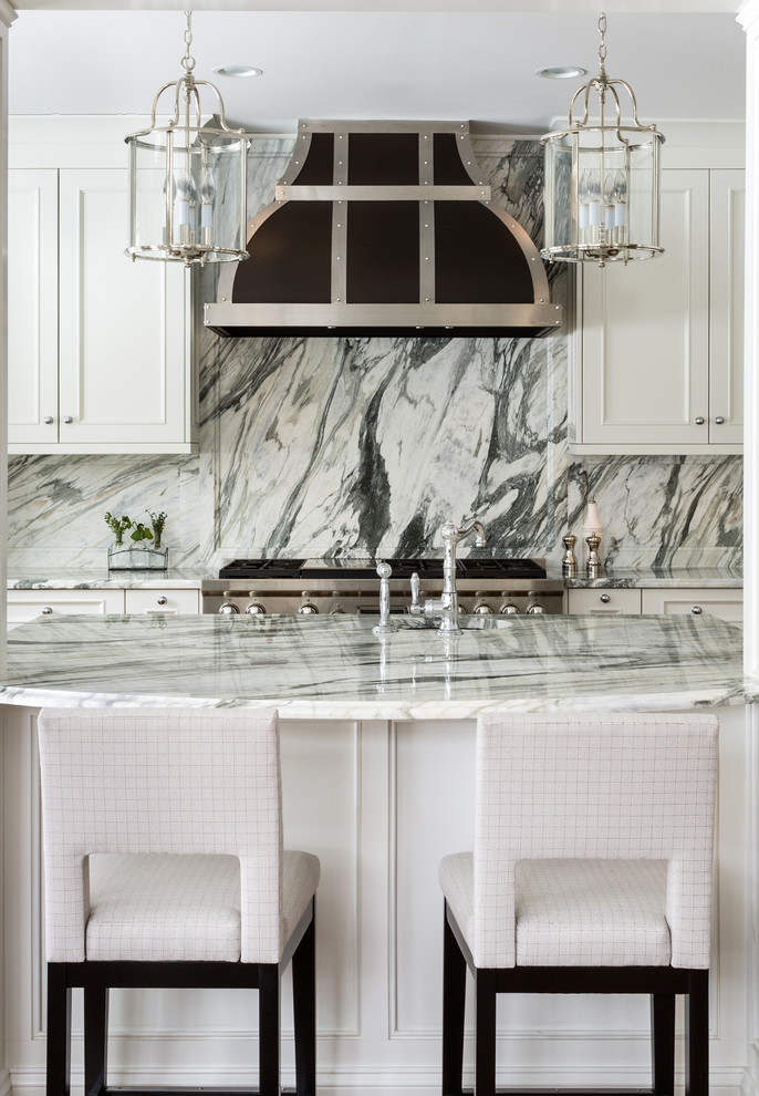 Inspiration for a medium sized traditional u-shaped kitchen/diner in DC Metro with a built-in sink, recessed-panel cabinets, white cabinets, marble worktops, multi-coloured splashback, marble splashback, stainless steel appliances and an island.