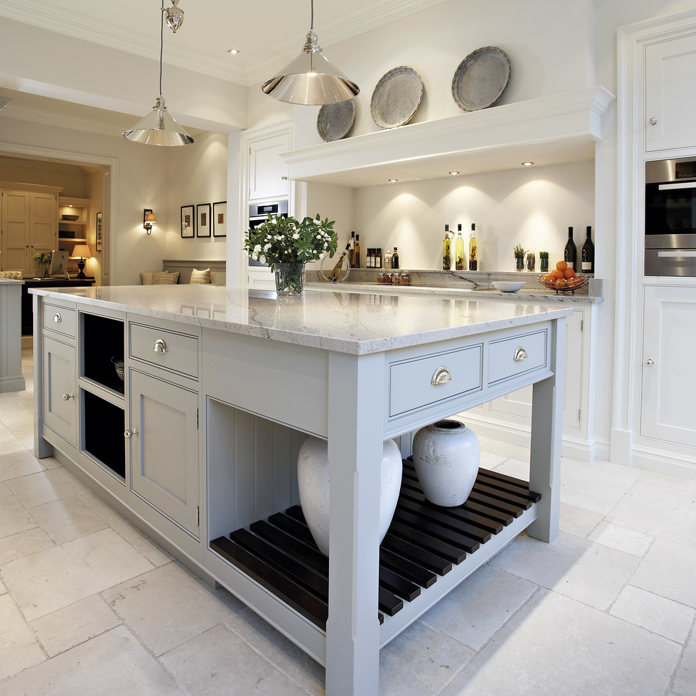 Medium sized grey and cream open plan kitchen in Manchester with grey cabinets, granite worktops, stainless steel appliances, marble flooring, an island and beaded cabinets.