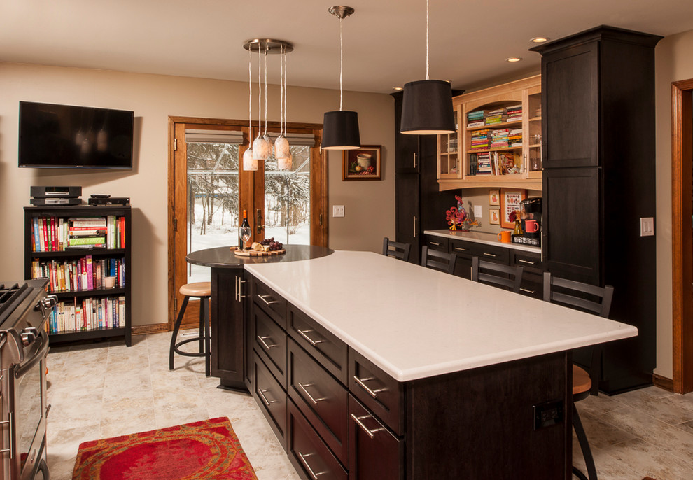 Photo of a medium sized traditional l-shaped kitchen/diner in New York with a submerged sink, black cabinets, engineered stone countertops, stainless steel appliances, flat-panel cabinets, red splashback, mosaic tiled splashback and an island.