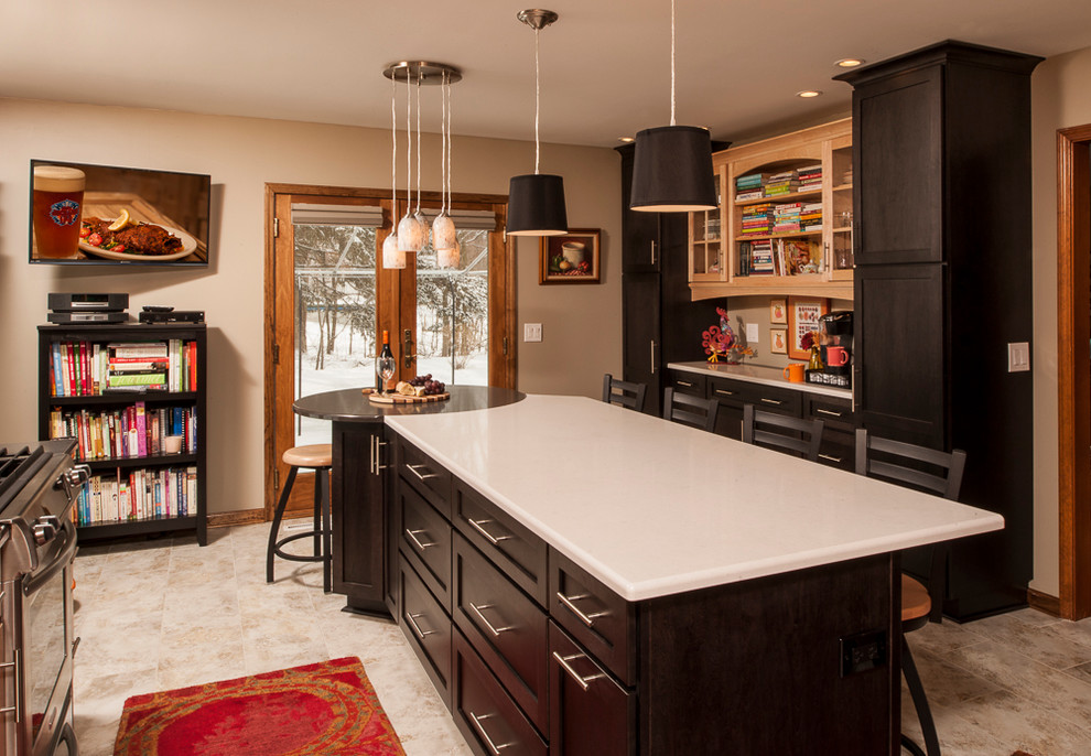 Mid-sized transitional l-shaped eat-in kitchen photo in New York with an undermount sink, flat-panel cabinets, black cabinets, quartz countertops, stainless steel appliances, red backsplash, mosaic tile backsplash and an island