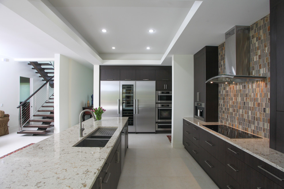 Inspiration for a mid-sized contemporary u-shaped porcelain tile and white floor open concept kitchen remodel in Tampa with an undermount sink, flat-panel cabinets, dark wood cabinets, quartz countertops, multicolored backsplash, glass tile backsplash, stainless steel appliances and an island