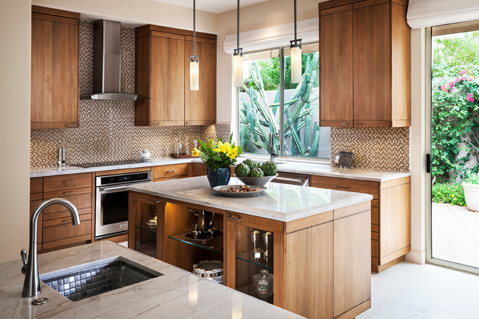 Mid-sized transitional u-shaped porcelain tile and beige floor kitchen photo in Phoenix with an undermount sink, flat-panel cabinets, quartzite countertops, beige backsplash, mosaic tile backsplash, stainless steel appliances, an island and medium tone wood cabinets