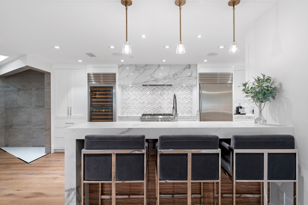 Inspiration for a contemporary kitchen remodel in Orange County with white cabinets