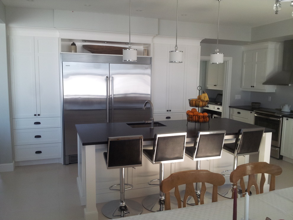 Contemporary white kitchen with quartz counter top Transitional