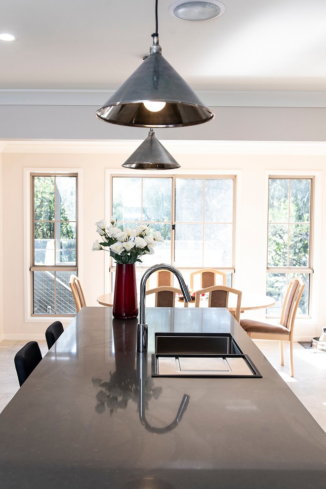 Photo of a large contemporary open plan dining room in Sydney with porcelain flooring and grey floors.