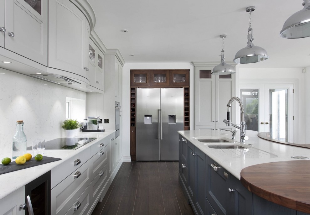 Classic kitchen in Other with dark hardwood flooring.