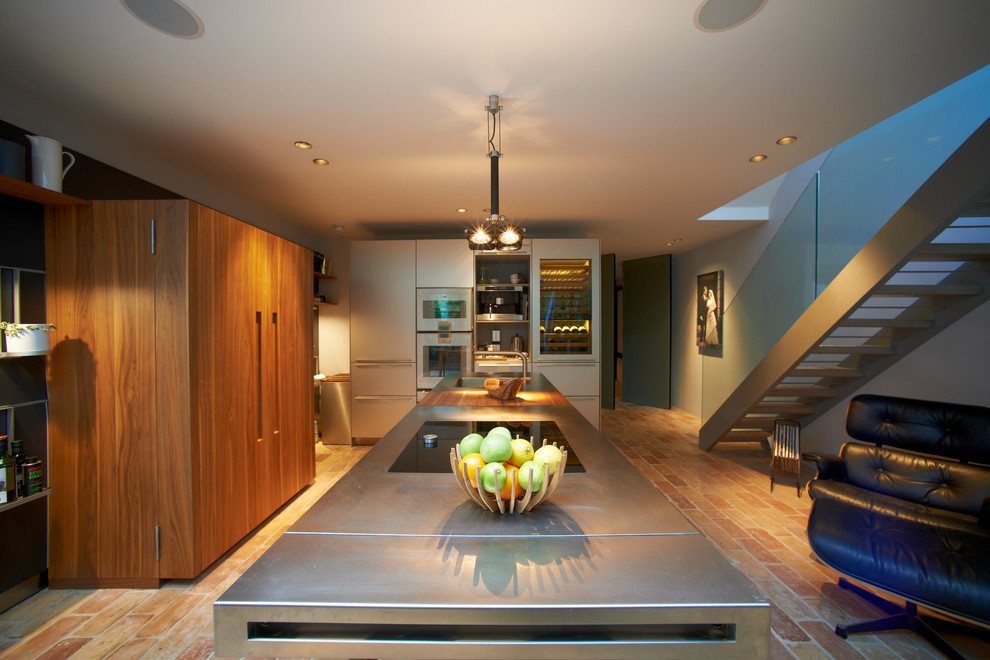 Kitchen - contemporary kitchen idea in Salt Lake City with an integrated sink, flat-panel cabinets, white cabinets, stainless steel countertops and white appliances