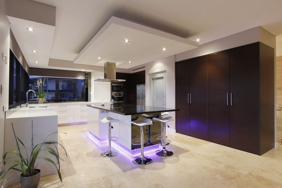 This is an example of a contemporary l-shaped kitchen in Perth with flat-panel cabinets and white cabinets.