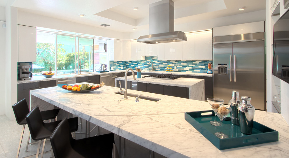 Design ideas for a contemporary kitchen/diner in San Francisco with blue splashback and glass tiled splashback.