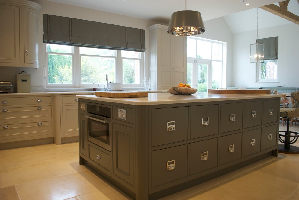 Design ideas for a large rural l-shaped kitchen/diner in Wiltshire with a belfast sink, beaded cabinets, grey cabinets, marble worktops, beige splashback, stainless steel appliances, limestone flooring and an island.