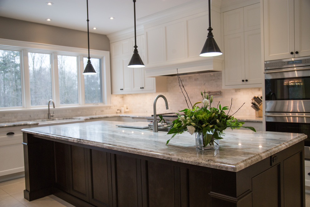 Inspiration for a large traditional kitchen/diner in Toronto with a double-bowl sink, recessed-panel cabinets, white cabinets, granite worktops, white splashback, stone tiled splashback, stainless steel appliances, porcelain flooring and an island.