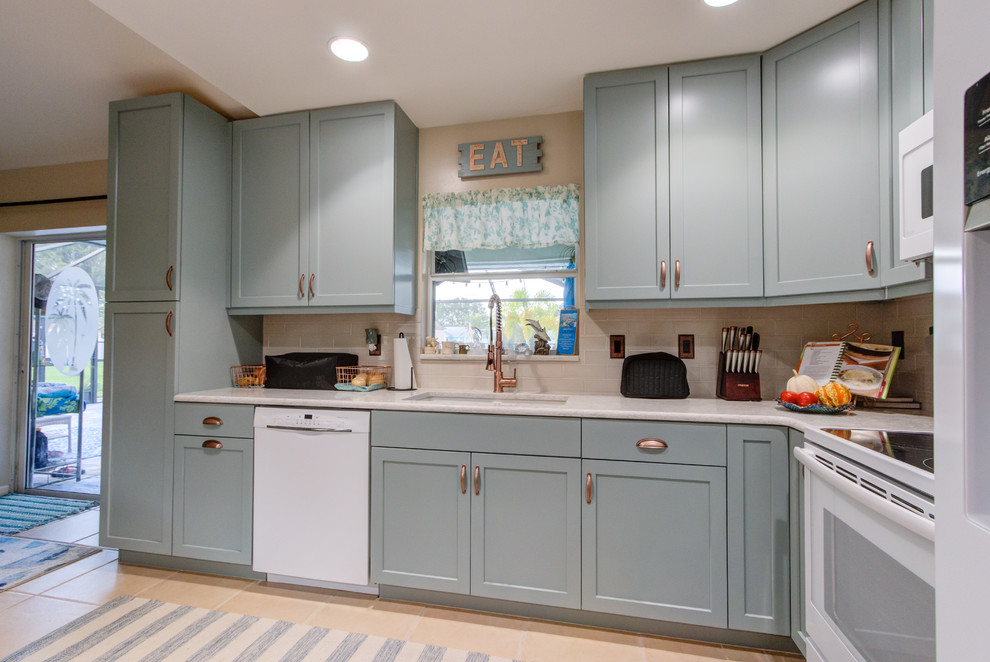 Inspiration for a small eclectic u-shaped enclosed kitchen remodel in Other with an undermount sink, shaker cabinets, turquoise cabinets, quartz countertops, beige backsplash, white appliances and turquoise countertops