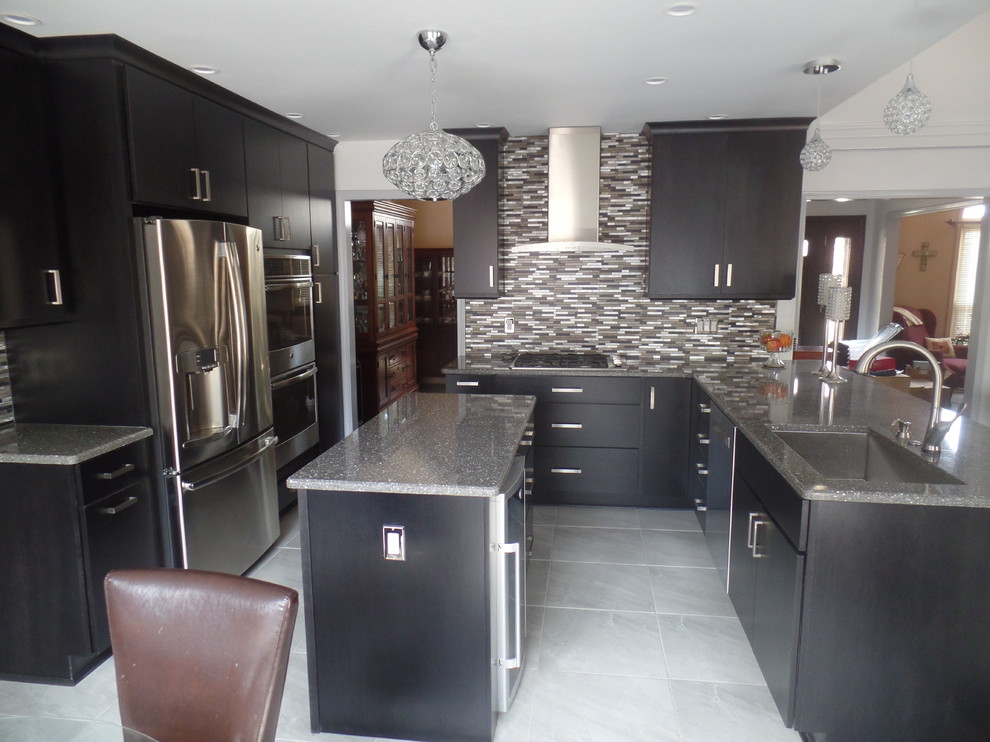 This is an example of a medium sized contemporary u-shaped open plan kitchen in Nashville with a single-bowl sink, flat-panel cabinets, dark wood cabinets, engineered stone countertops, multi-coloured splashback, metal splashback, stainless steel appliances, porcelain flooring and an island.