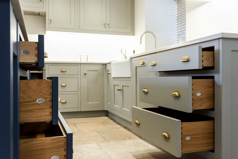 Photo of a classic kitchen/diner in Dorset with shaker cabinets and an island.
