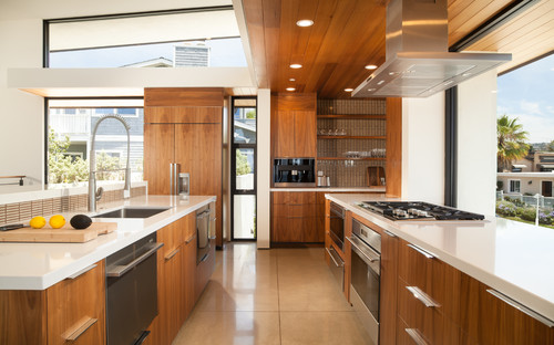 Modern kitchen design with plywood cabinets featuring natural wood veneer finish