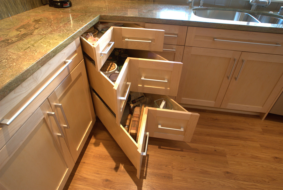 Inspiration for a mid-sized contemporary l-shaped bamboo floor and brown floor enclosed kitchen remodel in San Diego with an undermount sink, flat-panel cabinets, light wood cabinets, granite countertops, multicolored backsplash, glass sheet backsplash, black appliances and no island