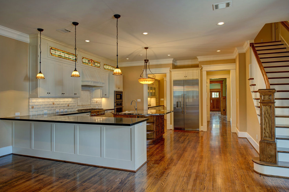 Example of an arts and crafts kitchen design in Houston