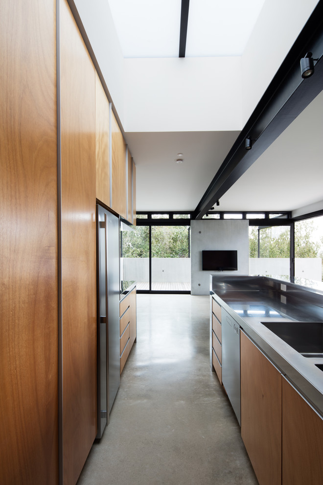 Example of a mid-century modern kitchen design in Auckland