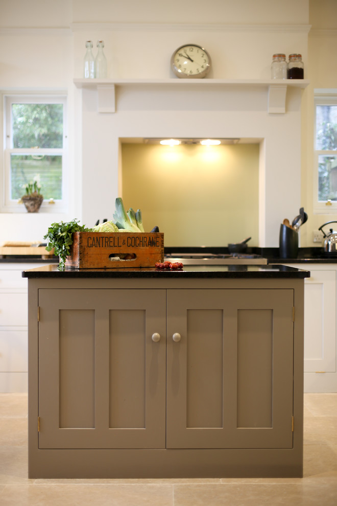 Inspiration for a mid-sized contemporary single-wall eat-in kitchen remodel in Other with shaker cabinets, white cabinets, granite countertops and an island