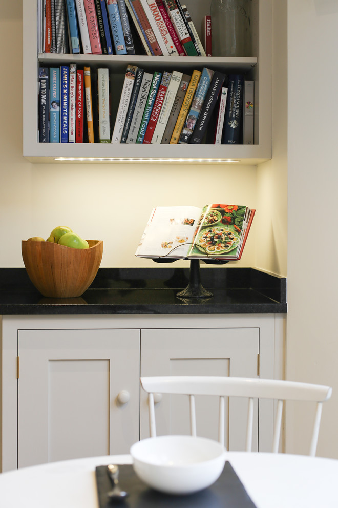 Inspiration for a mid-sized contemporary single-wall eat-in kitchen remodel in Other with shaker cabinets, white cabinets, granite countertops and an island