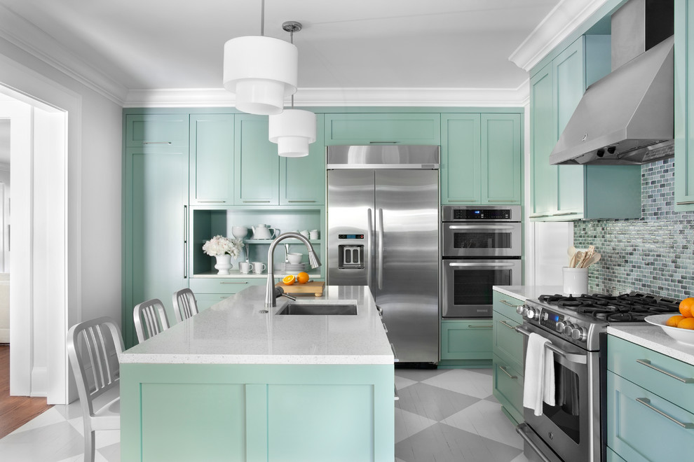 Example of a trendy multicolored floor kitchen design in Atlanta with stainless steel appliances and blue cabinets