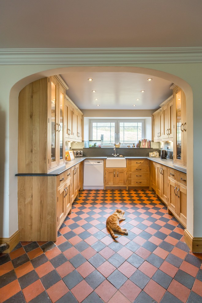 Design ideas for a small classic galley kitchen/diner with a belfast sink and orange floors.