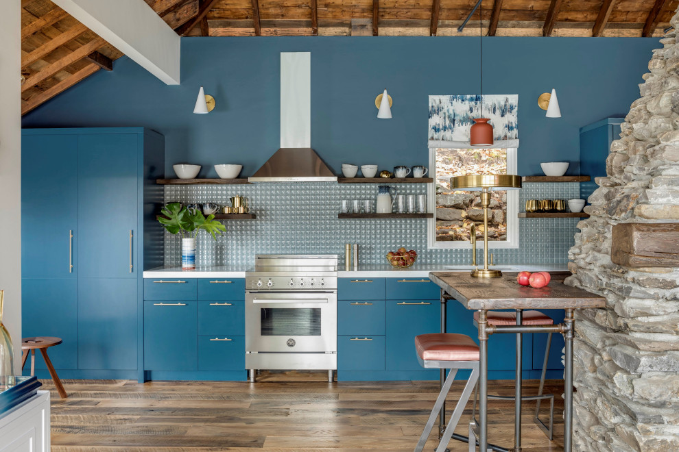 This is an example of a small rustic galley kitchen/diner in Boston with a single-bowl sink, flat-panel cabinets, blue cabinets, engineered stone countertops, blue splashback, white worktops, exposed beams, a vaulted ceiling, a wood ceiling, dark hardwood flooring and brown floors.